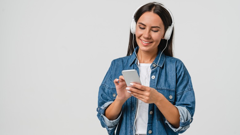 woman smiling with headphones on