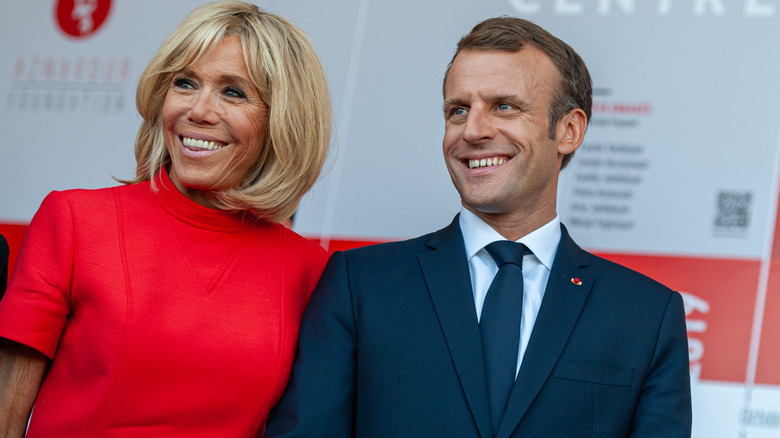 Emmanuel and Brigitte Macron posing together