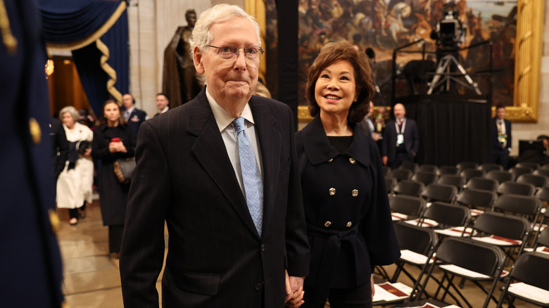 Elaine Chao and Mitch McConnell smiling
