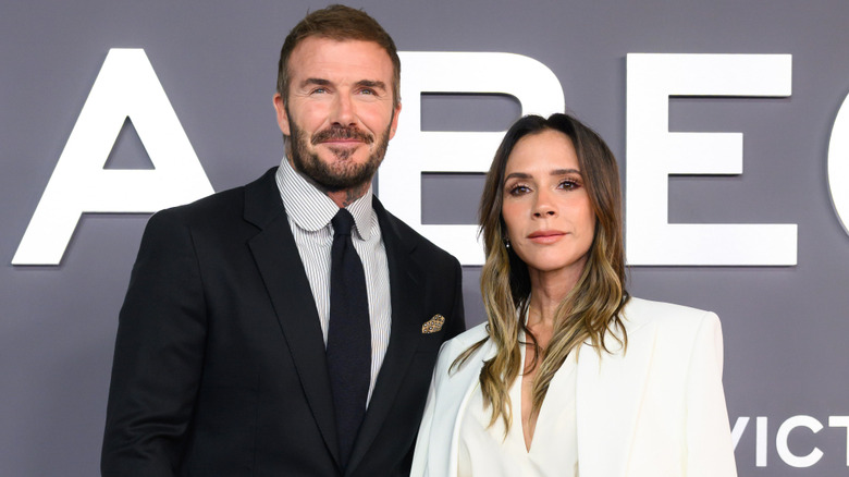 David and Victoria Beckham smiling