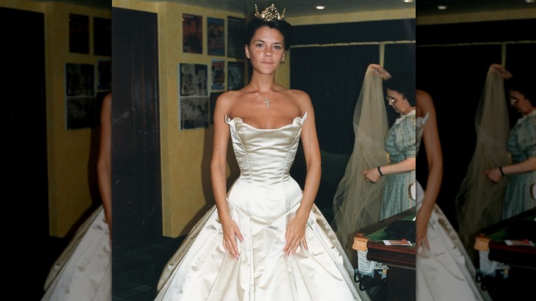 Victoria Beckham trying on her wedding dress