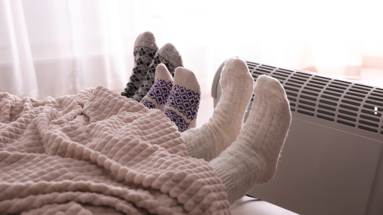 Feet next to heater