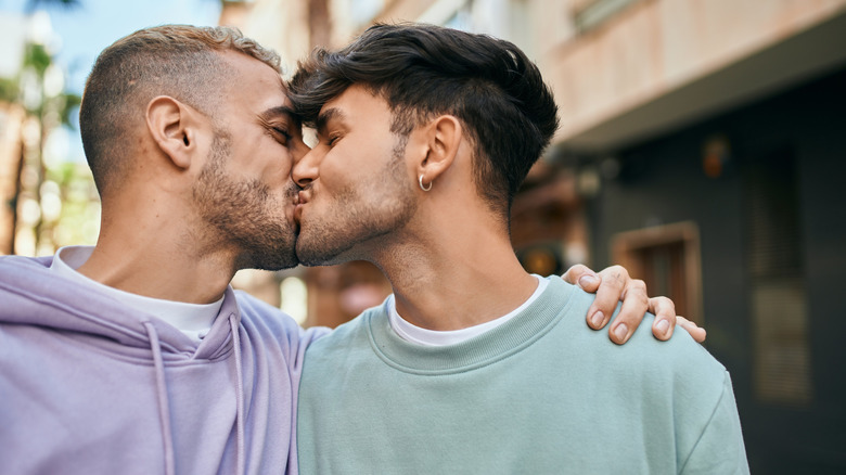 Couple kissing outside