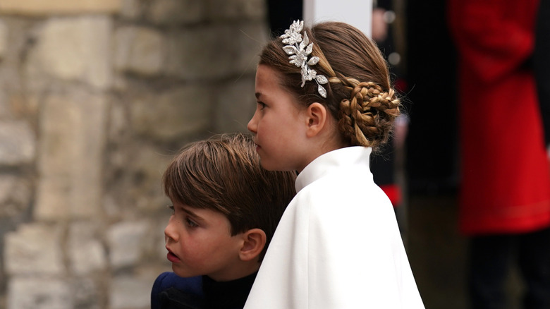 Prince Louis and Princess Charlotte standing together