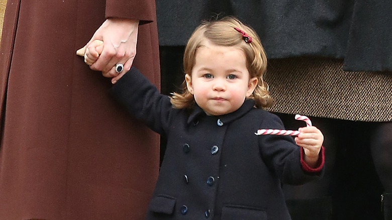 Princess Charlotte holding a candy cane