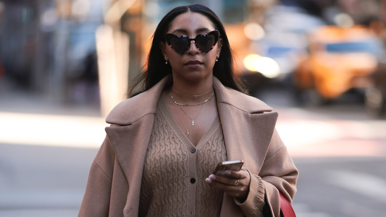 Woman wearing stacked necklaces