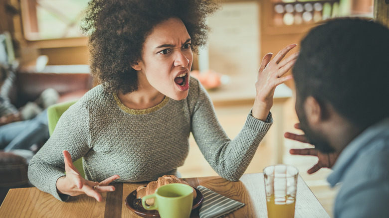 woman yelling at man