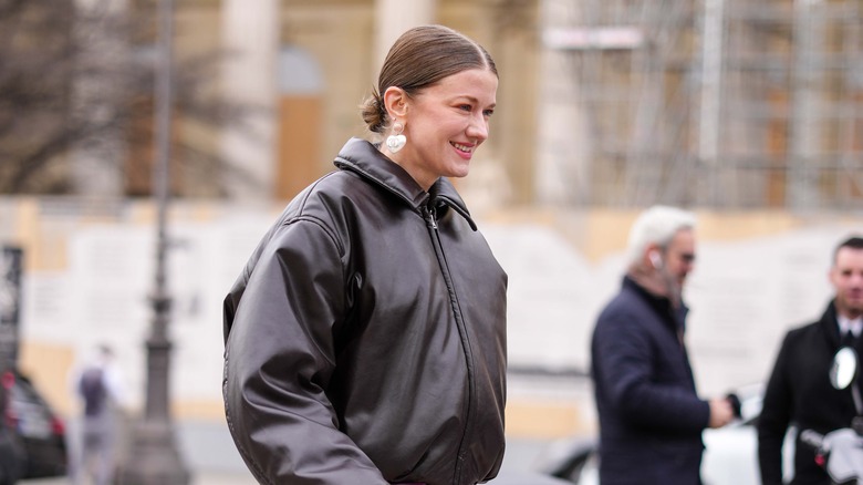 woman in puffy bomber jacket