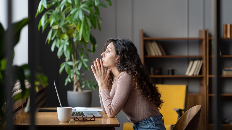 woman disengaged with work