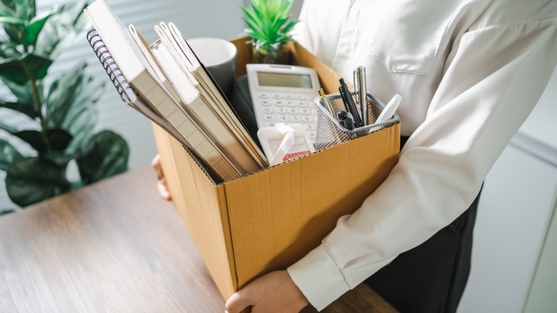 Person with box of office items
