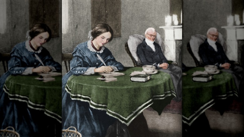 Portrait of Charlotte Brontë writing on papers at a table