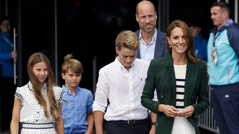 Kate Middleton walking with Princess Charlotte, Prince Louis, Prince George, and Prince William