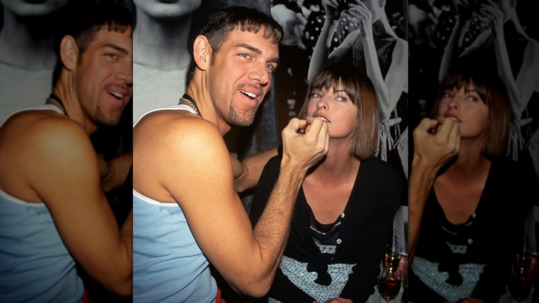 Kevyn Aucoin applying makeup to model Linda Evangelista