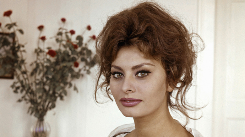 Sophia Loren wearing a low-cut white dress