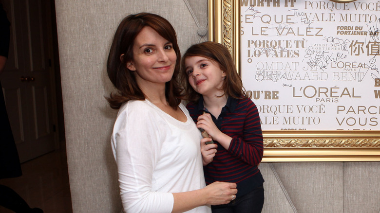 Tina Fey posing with her daughter Alice