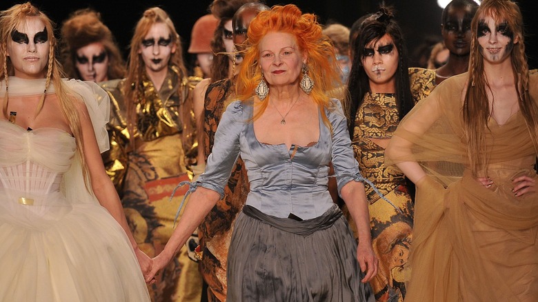 Vivienne Westwood walks the runway with her models for a 2011 ready-to-wear showcase.