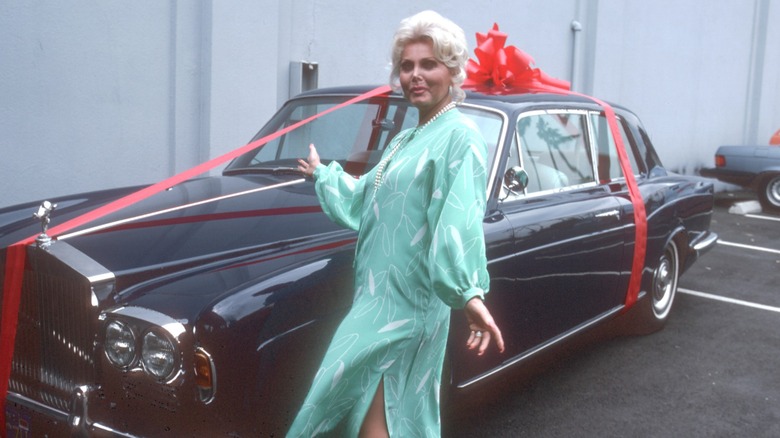 Zsa Zsa Gabor posing with her new Rolls Royce in 1978.