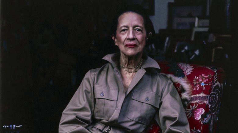 Diana Vreeland wearing a safari jacket, posing in a chair in 1975