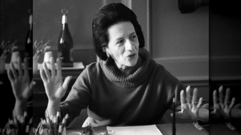 Diana Vreeland in her office wearing a turtleneck sweater in 1963