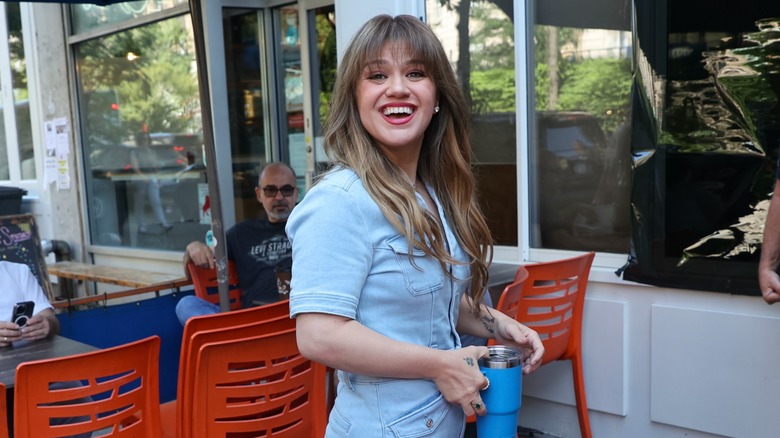 Kelly Clarkson spotted out in NYC in 2024 wearing a light blue outfit.