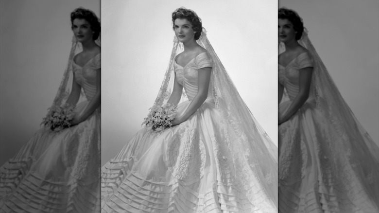Jackie Kennedy posing in her wedding dress in 1953