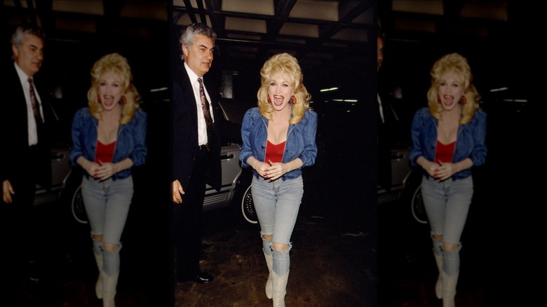 Dolly Parton smiles in a denim-on-denim outfit