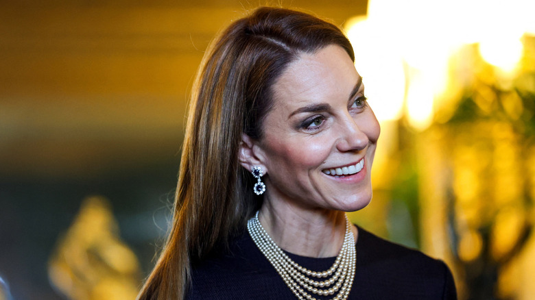 Kate Middleton with straight hair and a statement necklace in December 2025
