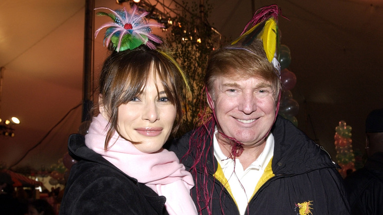 Donald and Melania Trump wearing carnival hats at a charity event