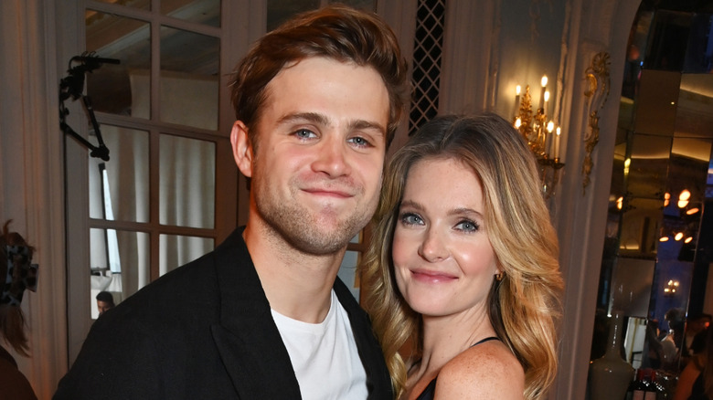 Leo Woodall and Meghann Fahy wearing black