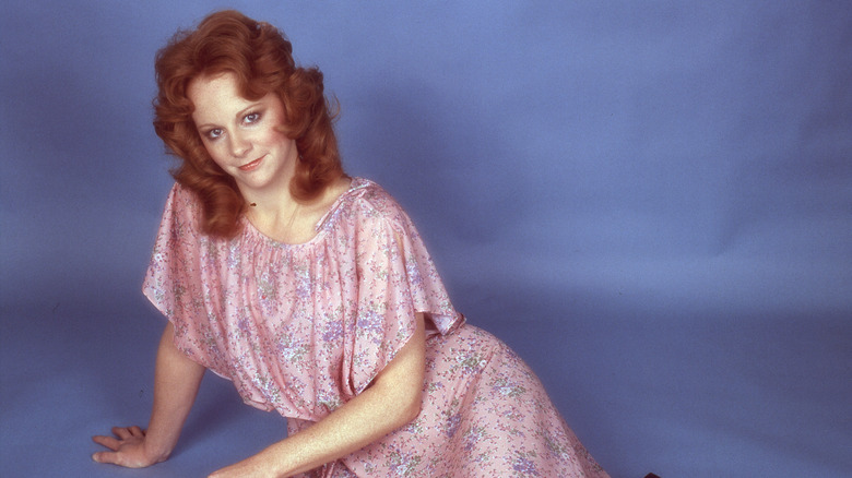 Young Reba McEntire posing in the 1970s