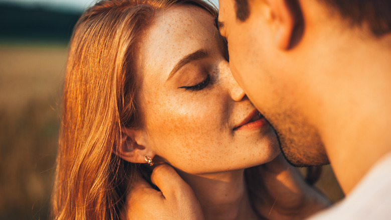 Couple kisses