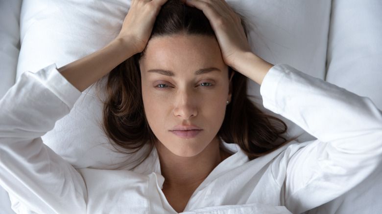 stressed woman in bed