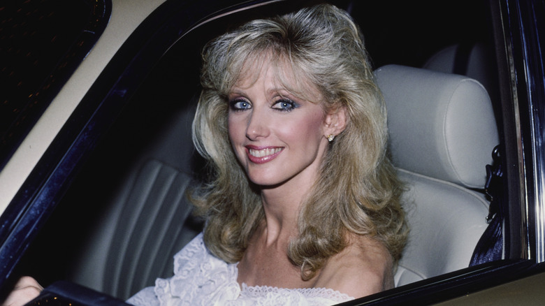 Morgan Fairchild driving in September 1984.