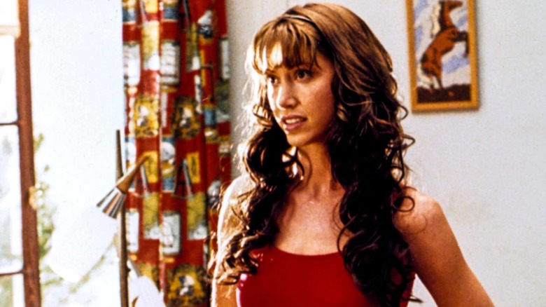 Shannon Elizabeth wearing a red tank top in 