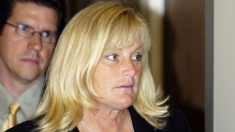 Debbie Rowe walking out of a courtroom in 2005