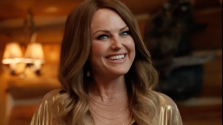 Actor Malin Akerman is seen wearing a brunette wig during a scene from Netflix's The Hunting Wives