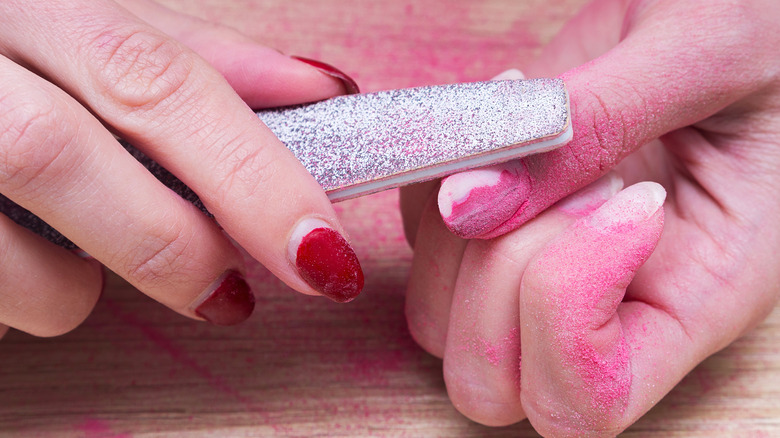 Woman removing nail polish