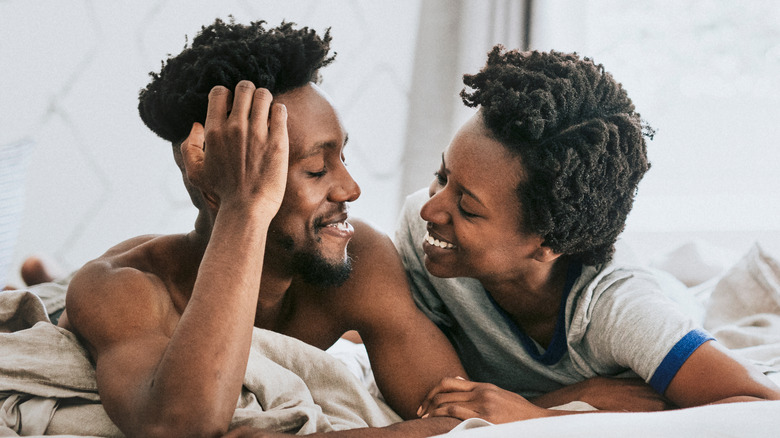 Couple relaxing in bed together