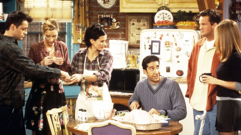 Matt LeBlanc, Lisa Kudrow, Courteney Cox, David Schwimmer, Matthew Perry, and Jennifer Aniston are pictured in a scene from the sitcom Friends.