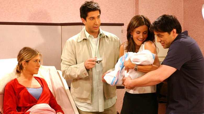 Jennifer Aniston, David Schwimmer, Courteney Cox, and Matt LeBlanc are pictured in a hospital scene during Friends.