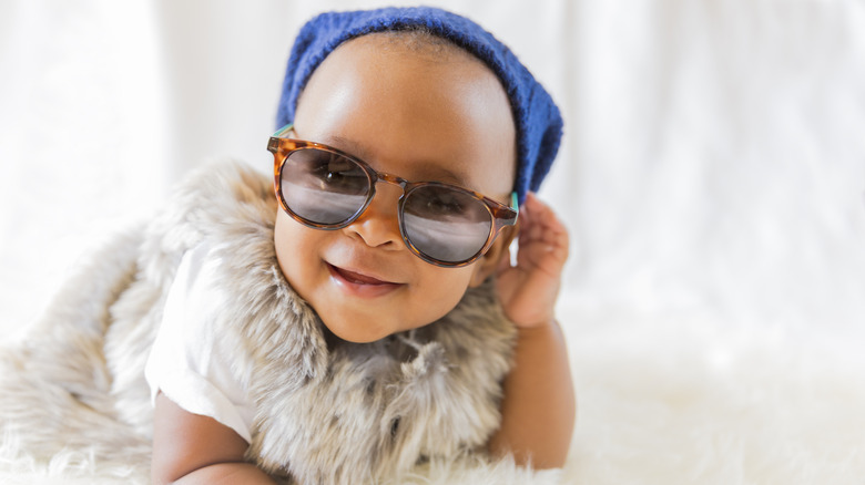 Baby with sunglasses and a hat