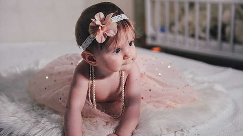 Baby in pearls and a tutu