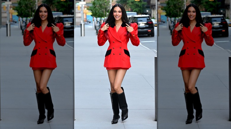 Kylie Cantrall wearing a red blazer with shoulder pads and a mini-skirt.