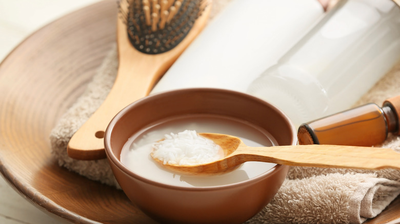 Spoon in a bowl of rice water