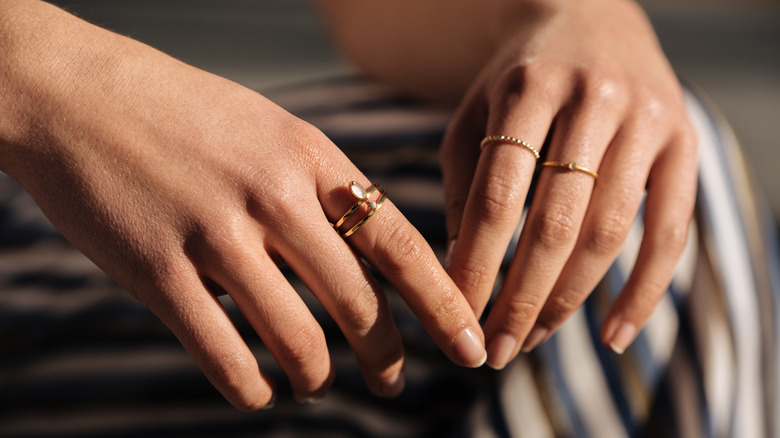 woman wearing decorative fashion rings