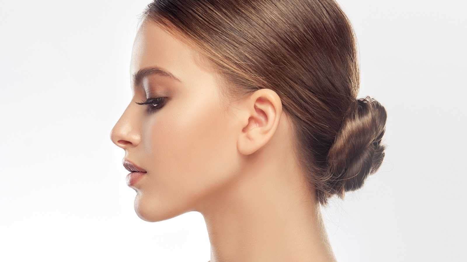 Rock A Chic, Slicked-Back Bun Without Damaging Your Hair With This Tip