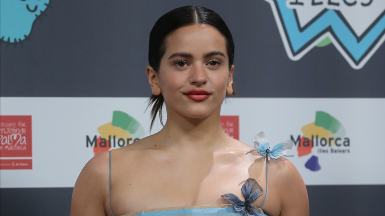 Rosalía in a blue sheer outfit