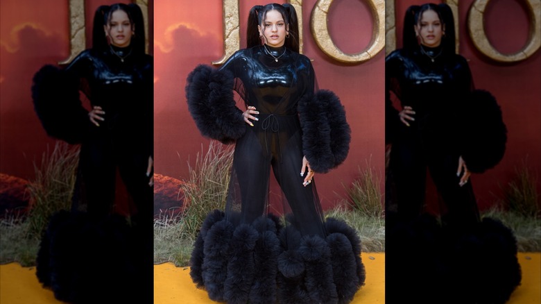 Rosalía wearing a black latex bodysuit