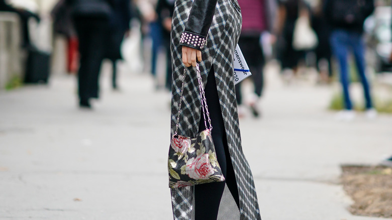 woman with rose print bag