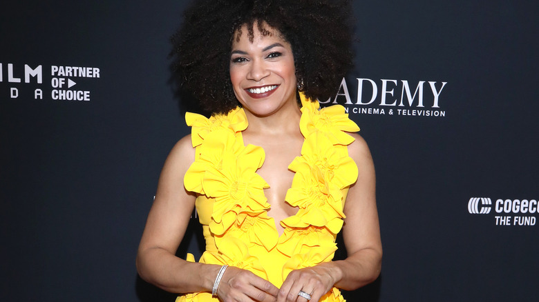 woman in ruffled yellow dress